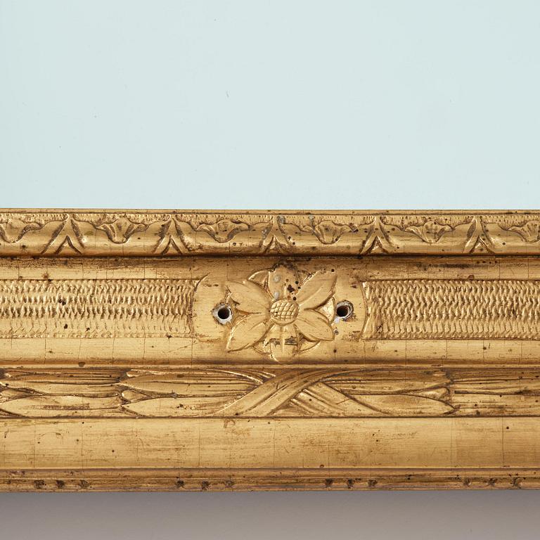 A Gustavian giltwood frame with mirror glass, late 18th century.