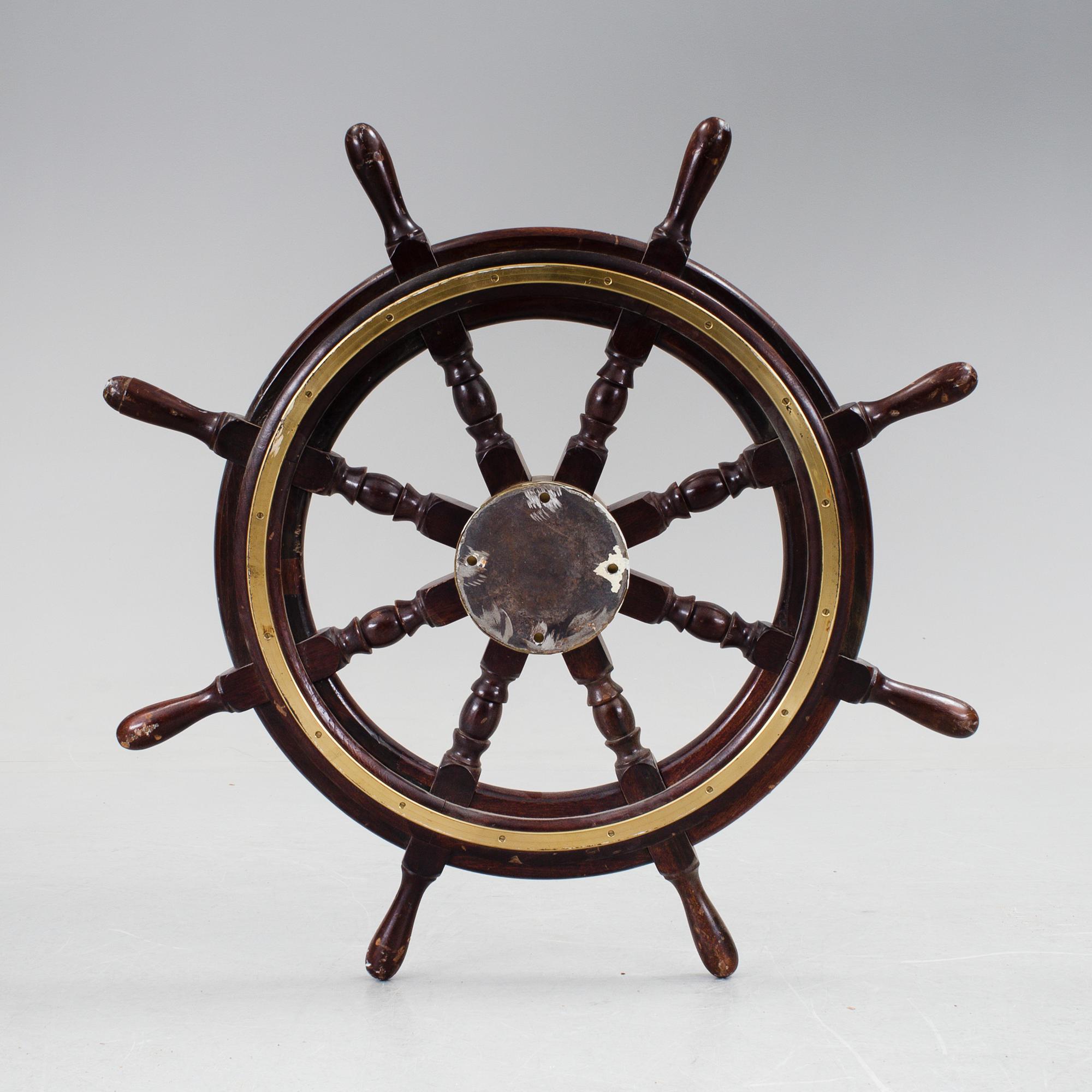 A ship steering wheel by John Hastle& Co Greenock, England, early 20th century.