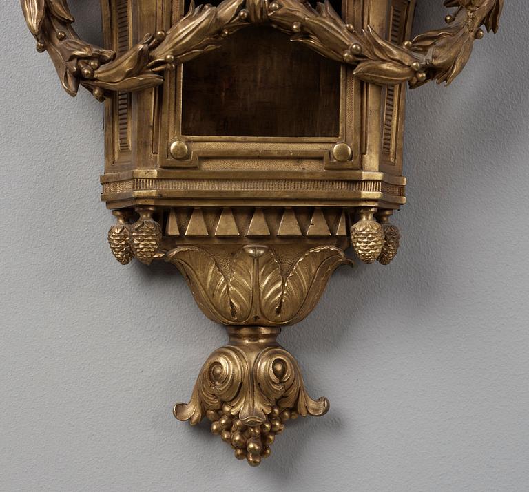 A Louis XVI late 18th century gilt bronze wall clock.