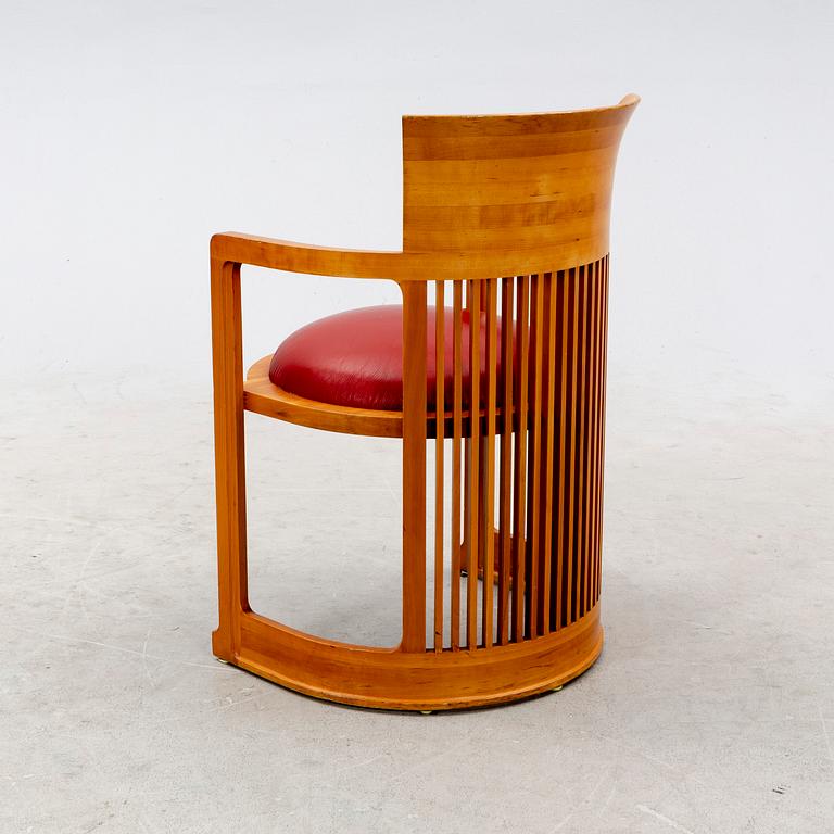 A cherry wood model 606 'Barrel' chair by Frank Lloyd Wright from Cassina.