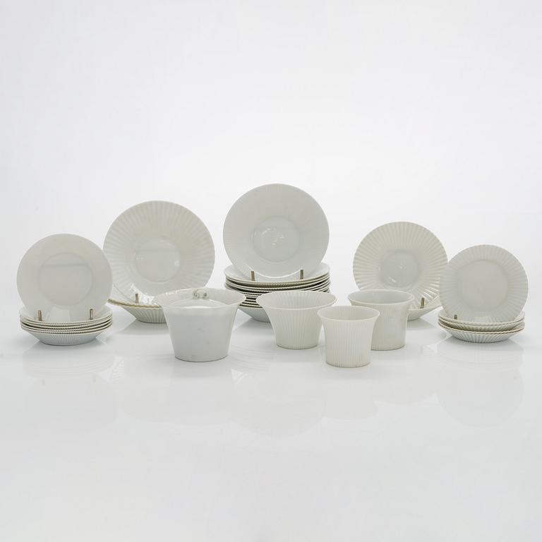 Aune Siimes, a set of twenty 1960's porcelain cream cups and twenty nine saucers for Arabia.