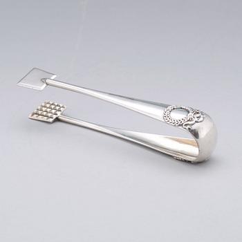 A Fabergé 20th century silver sugar-tongs, work master Anders Michelsen 1908-1917. Imperial Warrant.