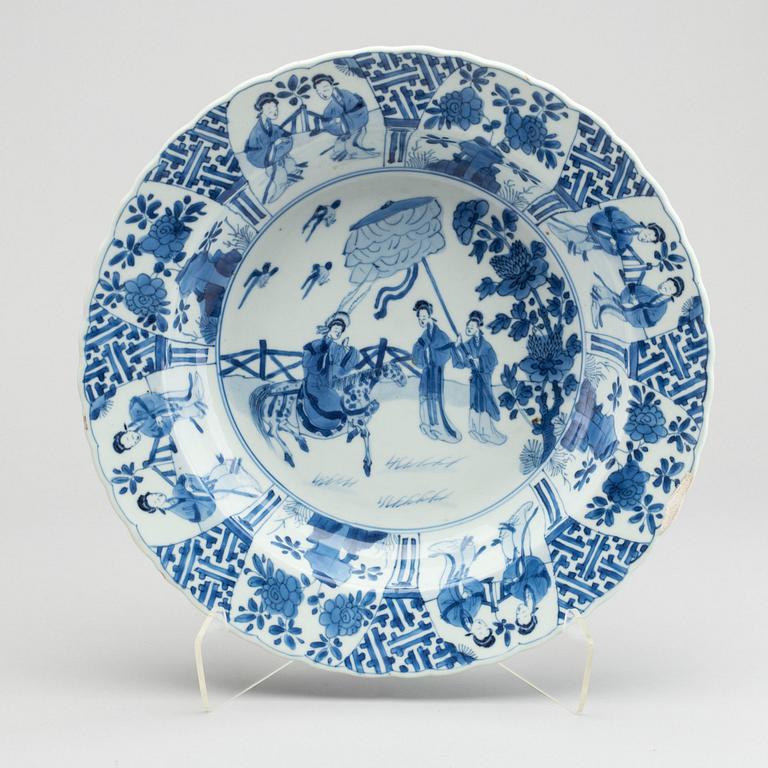 A large blue and white deep dish, Qing dynasty, with Kangxi six character mark and period (1662-1722).