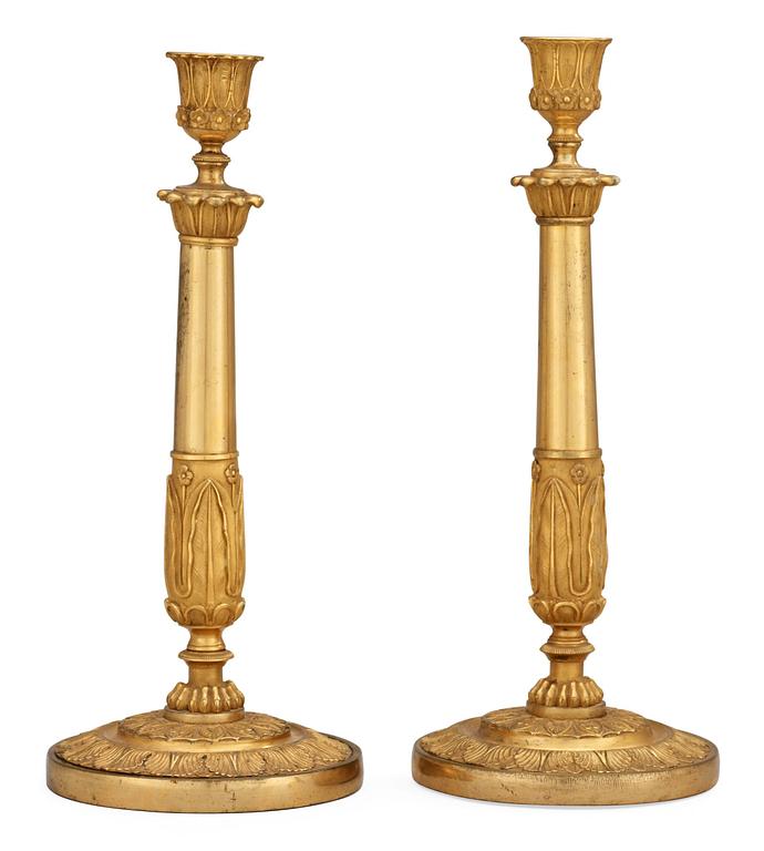 A pair of Empire early 19th century candlesticks.