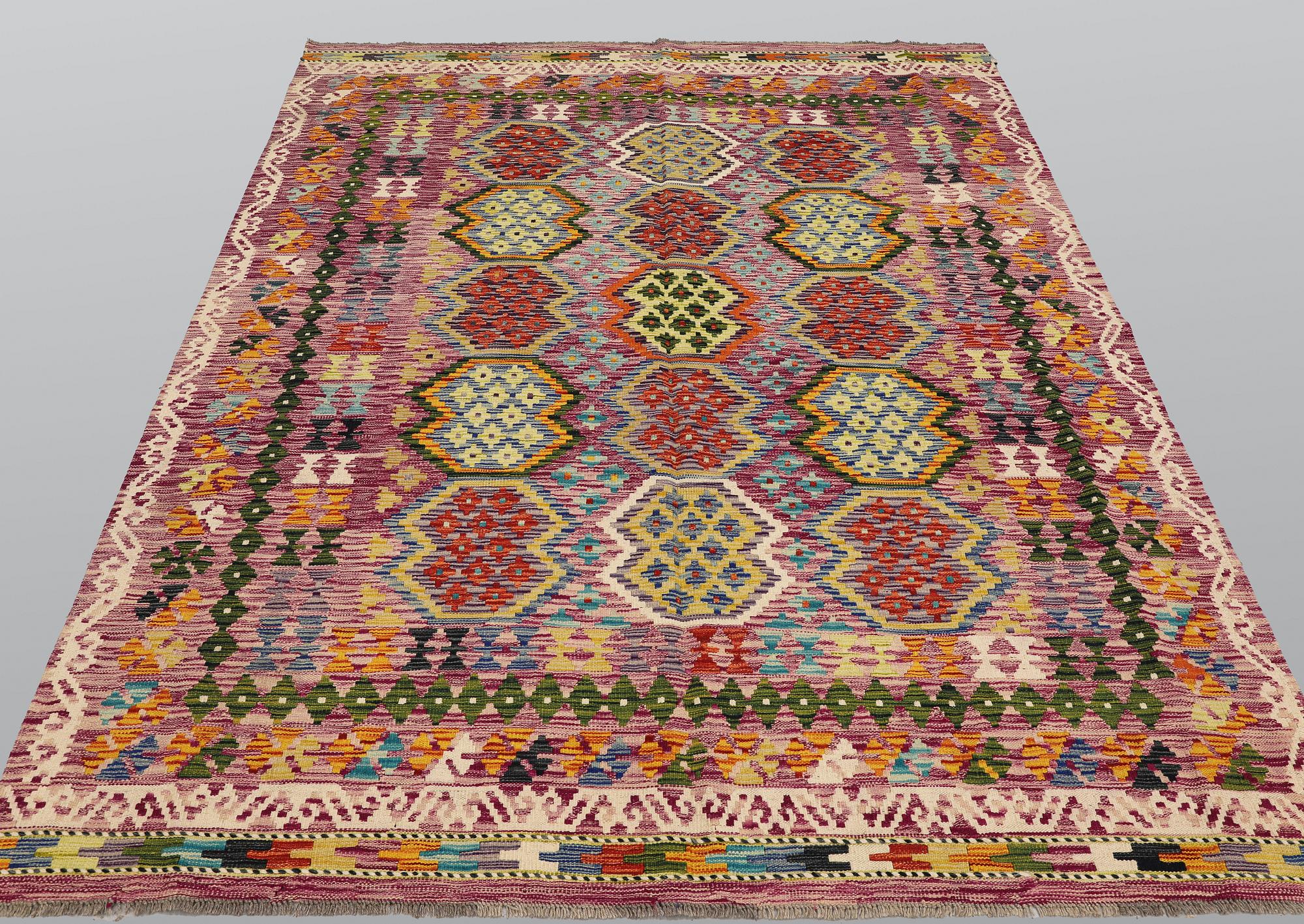 A Kilim rug, approx. 244 x 197 cm.