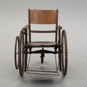An early 20th century wheel chair.