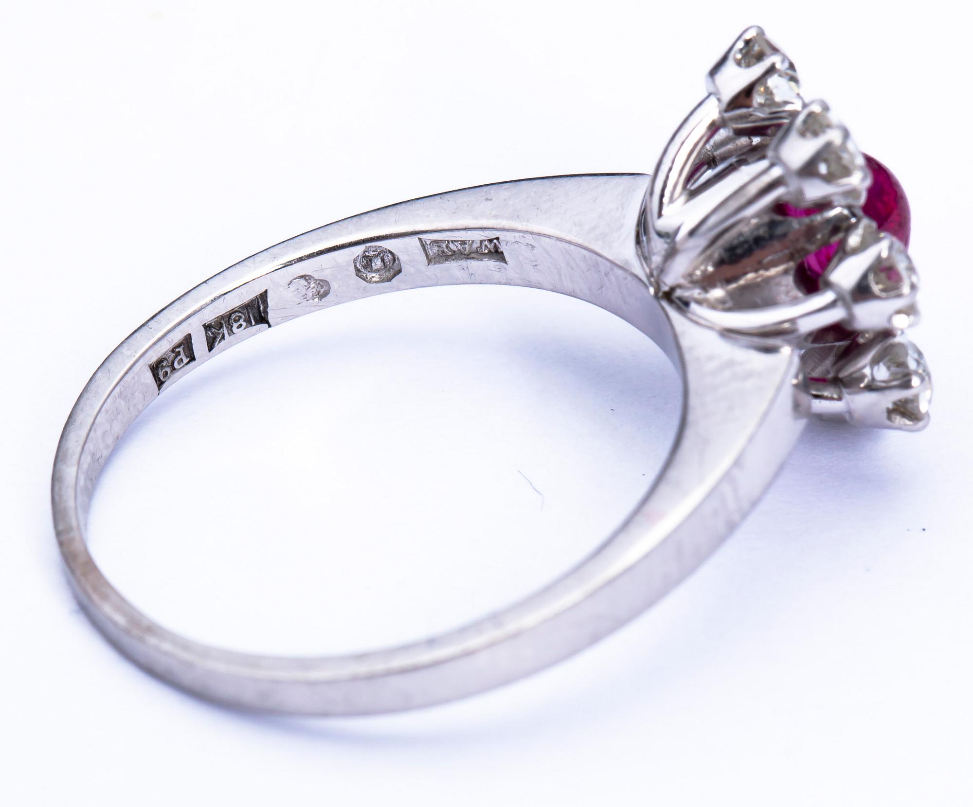RING, 18 k vitguld, W.A Bolin, Stockholm, 1965, cabochonslipad rubin samt diamanter ca 0.70 ct. Vikt ca 6 g.