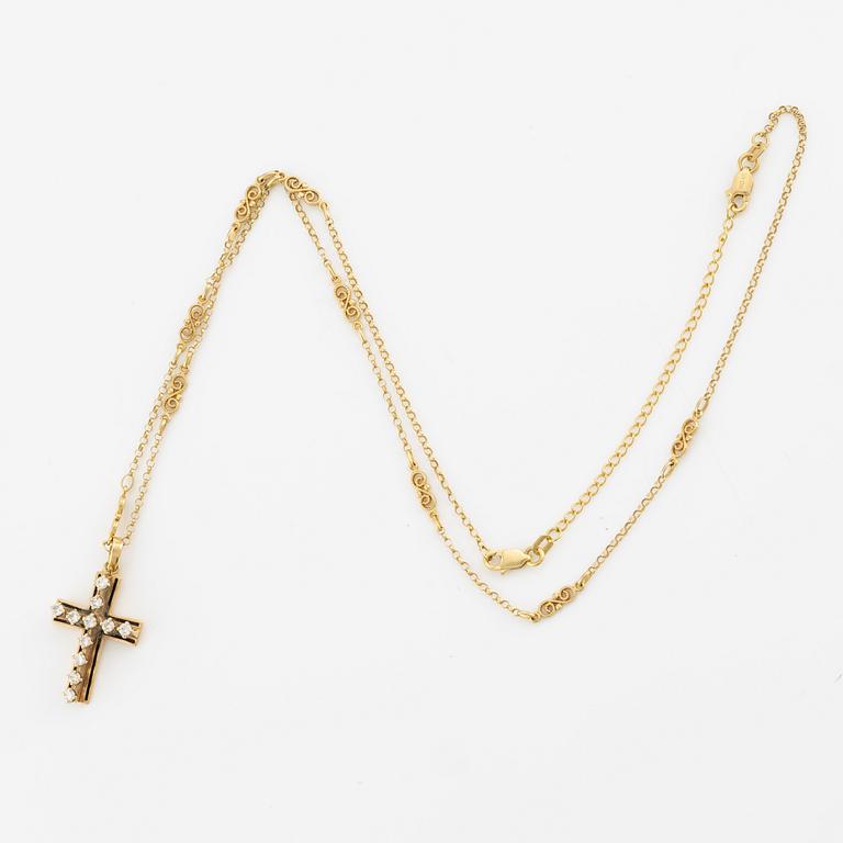 Pendant in the form of a cross with a chain, 14K gold with enamel and round brilliant-cut diamonds.