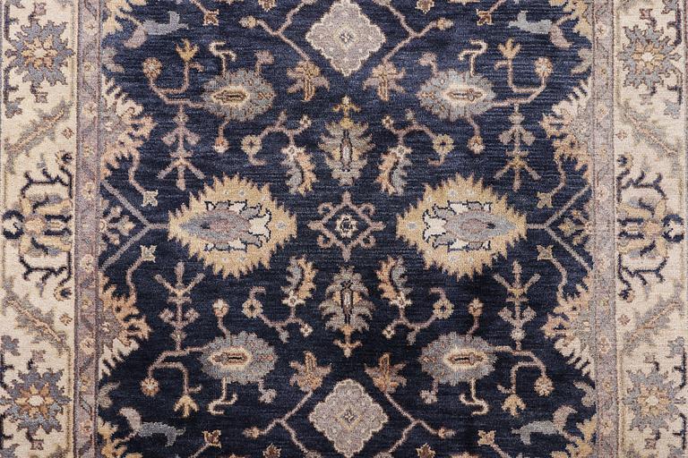 A Mamluk design carpet, c. 305 x 245 cm.