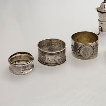 Napkin rings, 6 pcs, a pair of salt shakers, and salt cellars, silver and glass, including English and Finnish marks.