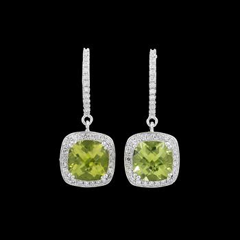 87. A pair of peridot, circa 5.30 cts, and diamond, circa total 1.10 cts, earrings.