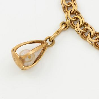 Bracelet, 18K gold with charms.