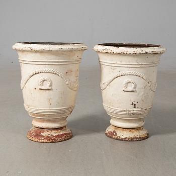 Urnor ett par gjutjärn omkring 1900.