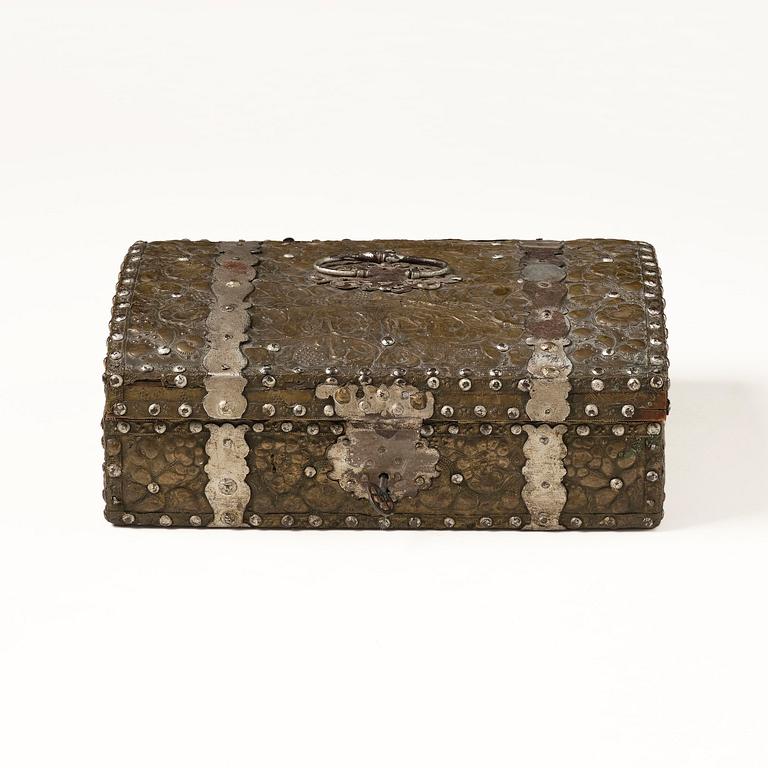 A presumably German baroque repoussé brass writing box, late 17th century.