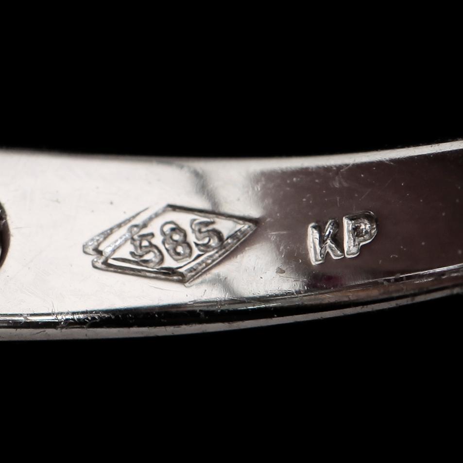RING, 14K vitguld, rubiner och briljantslipade diamanter. Vikt ca 3 g.