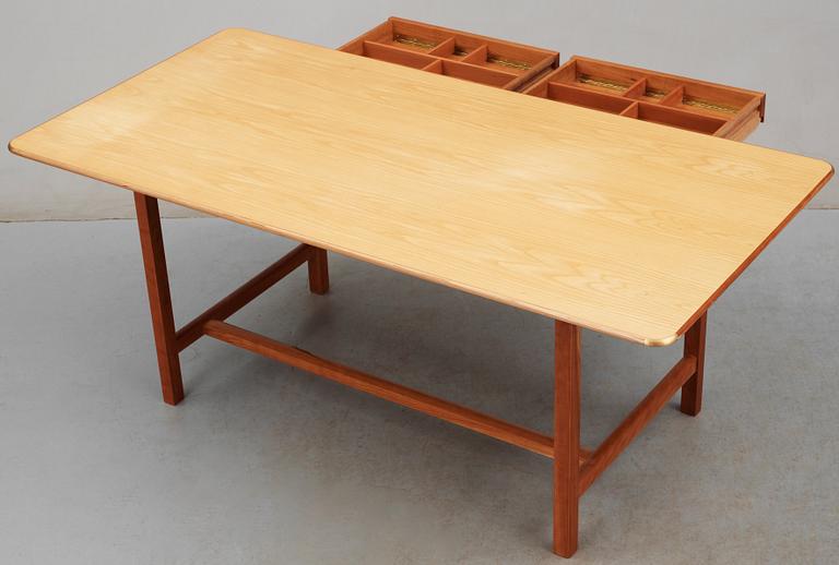A Josef Frank ash and mahogany desk with brass fittings, by Svenskt Tenn.