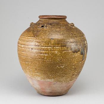 A olive green glazed jar, South East Asia, 18th Century or older.