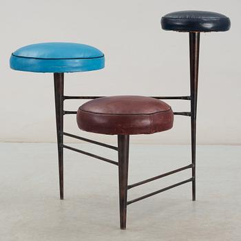 A 1950's black lacquered iron and leather stool, possibly Italy.