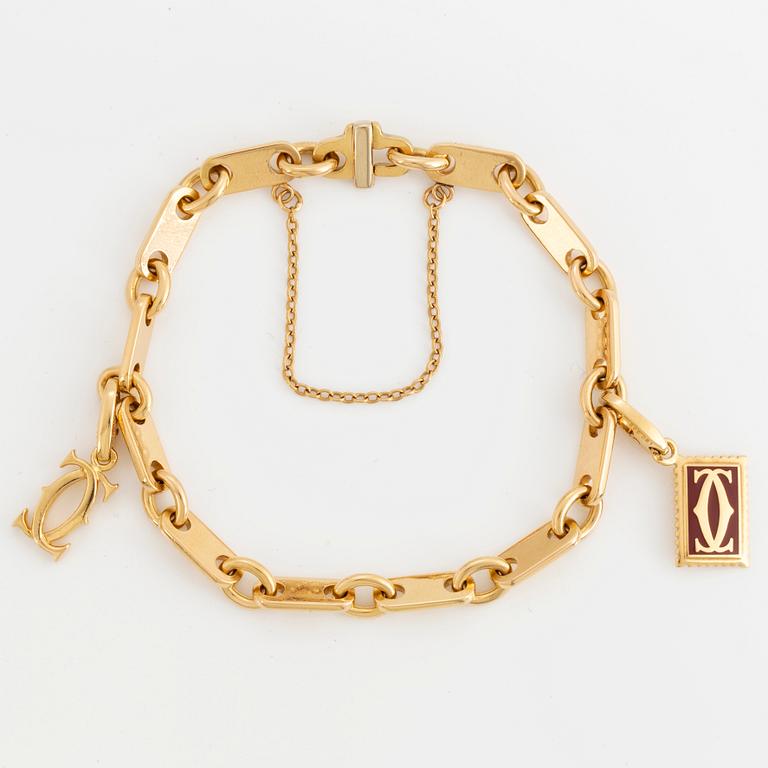 Cartier 18K gold charm bracelet.