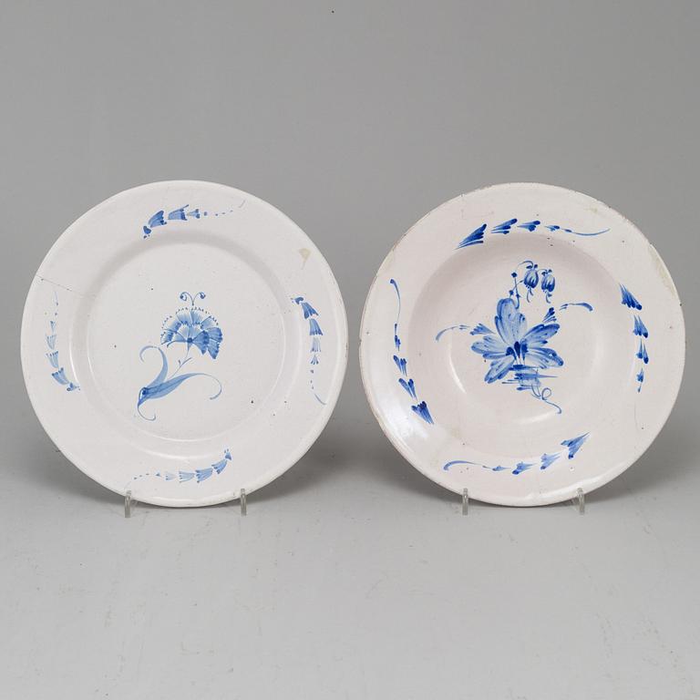 A set of four 18th Century faience dishes, one marked Marieberg.