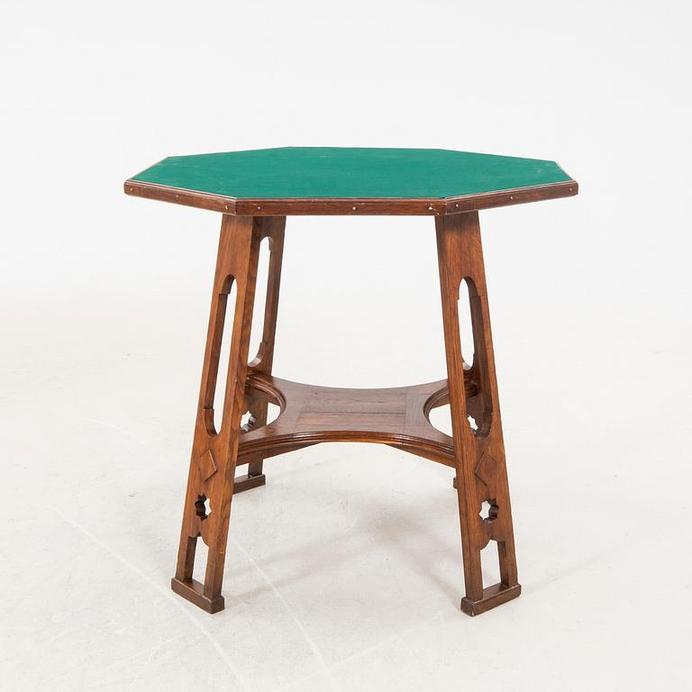 An early 1900s oak game table.