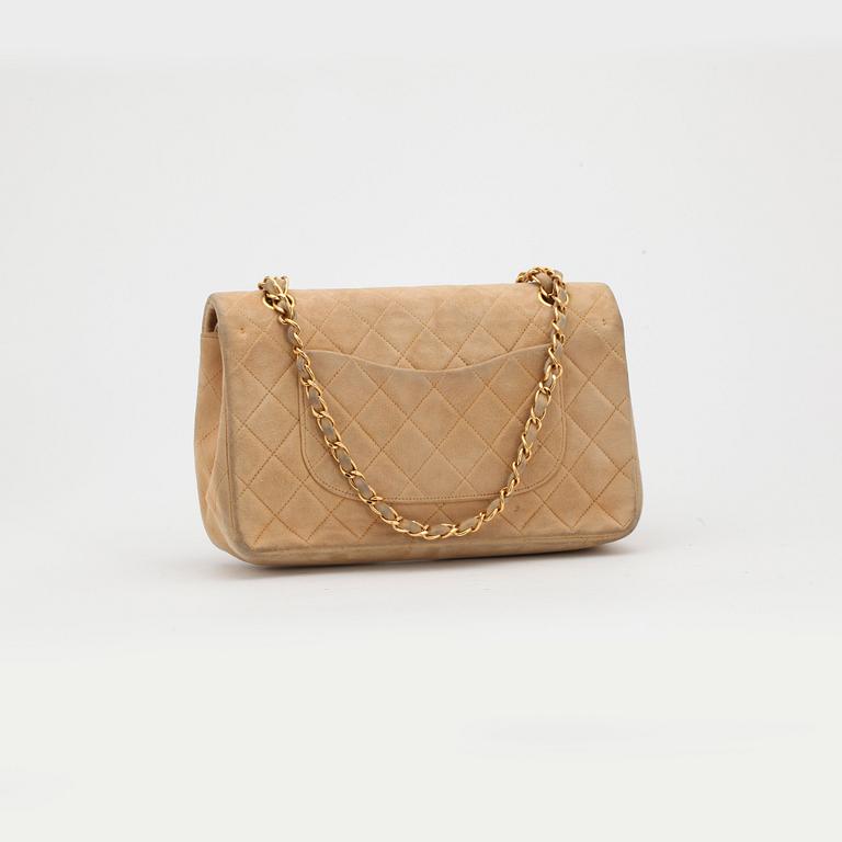 CHANEL, a beige suede quilted "double flap" shoulder bag.