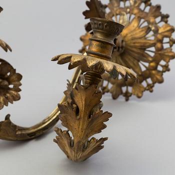 A pair of metal wall scones, around 1900.