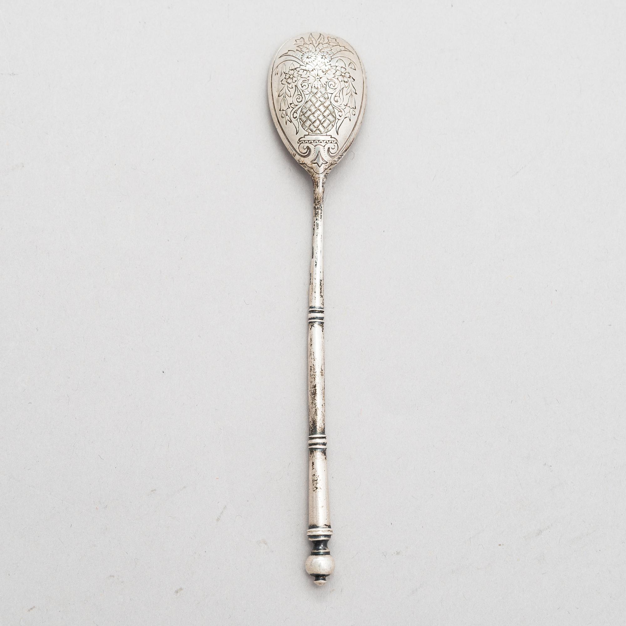 A Russian silver tea glass holder and a tea spoon, Moscow, Alexander Fuld 1889 and Antip Kuzmichev 1888. Glass, Finland.