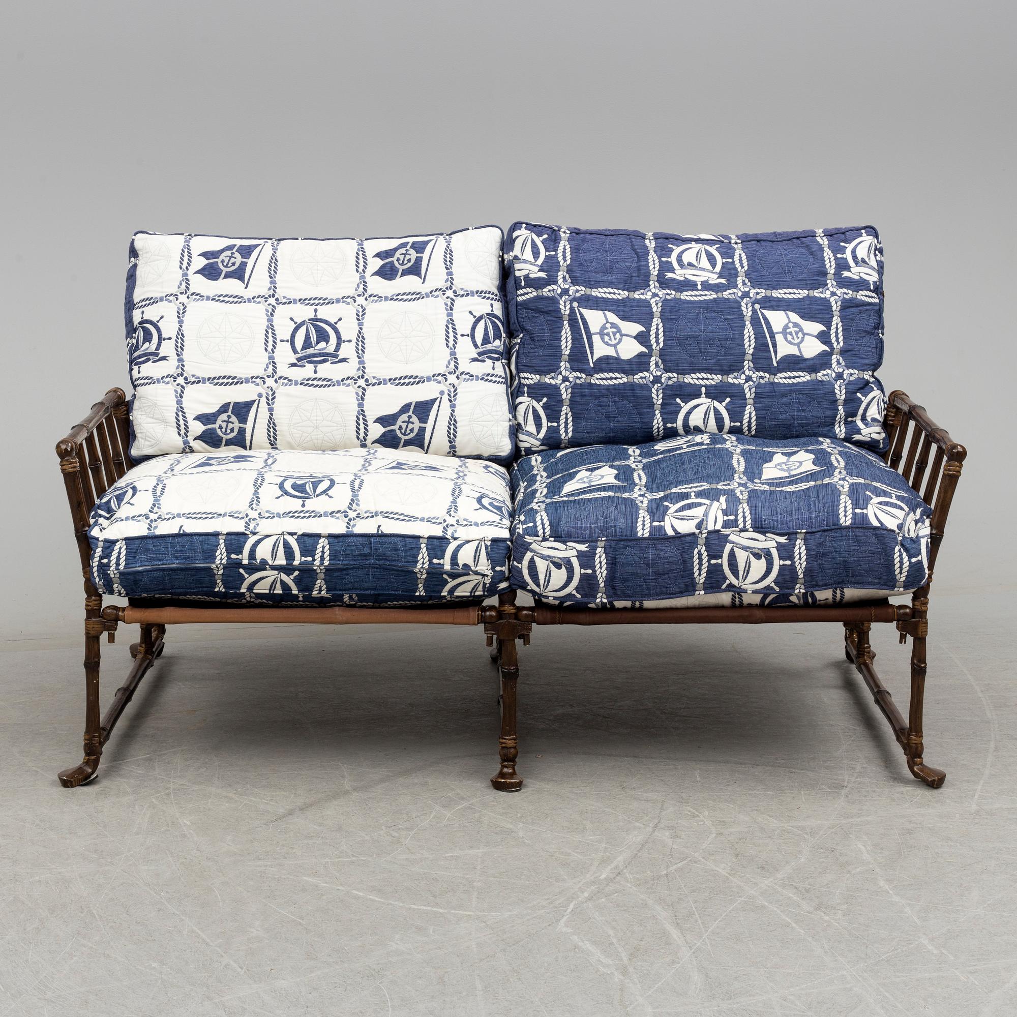 A contemporary bamboo imitating garden sofa.
