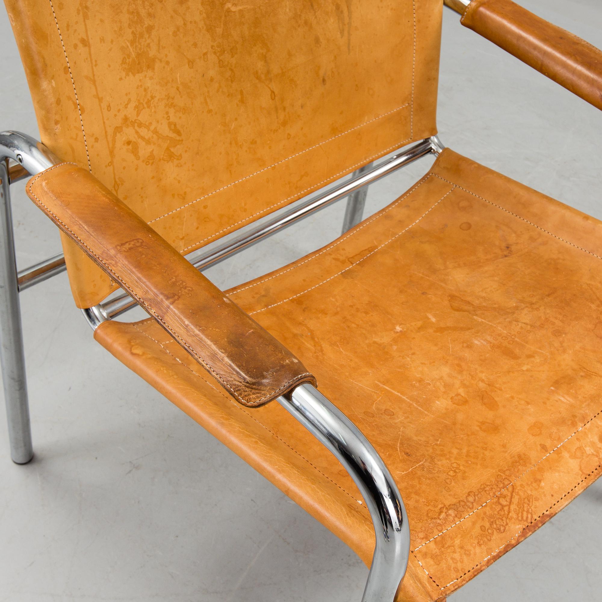 a leather and metal armchair, probably by IKEA.
