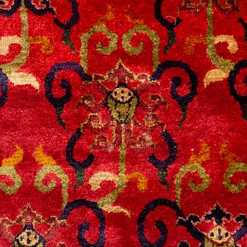 An East Turkestan silk carpet, c. 308 x 182 cm.