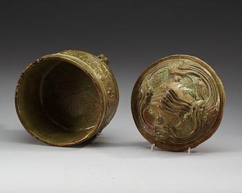 A green glazed tripod censer with cover, Han dynasty (206 BC - 220 AD).