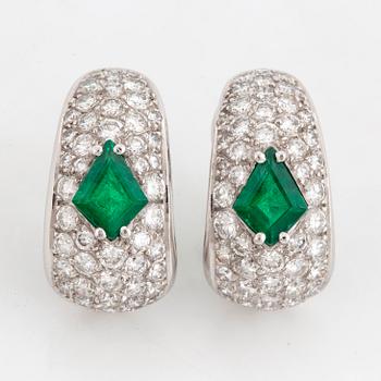 A pair of WA Bolin earrings set with faceted emeralds and round brilliant-cut diamonds.