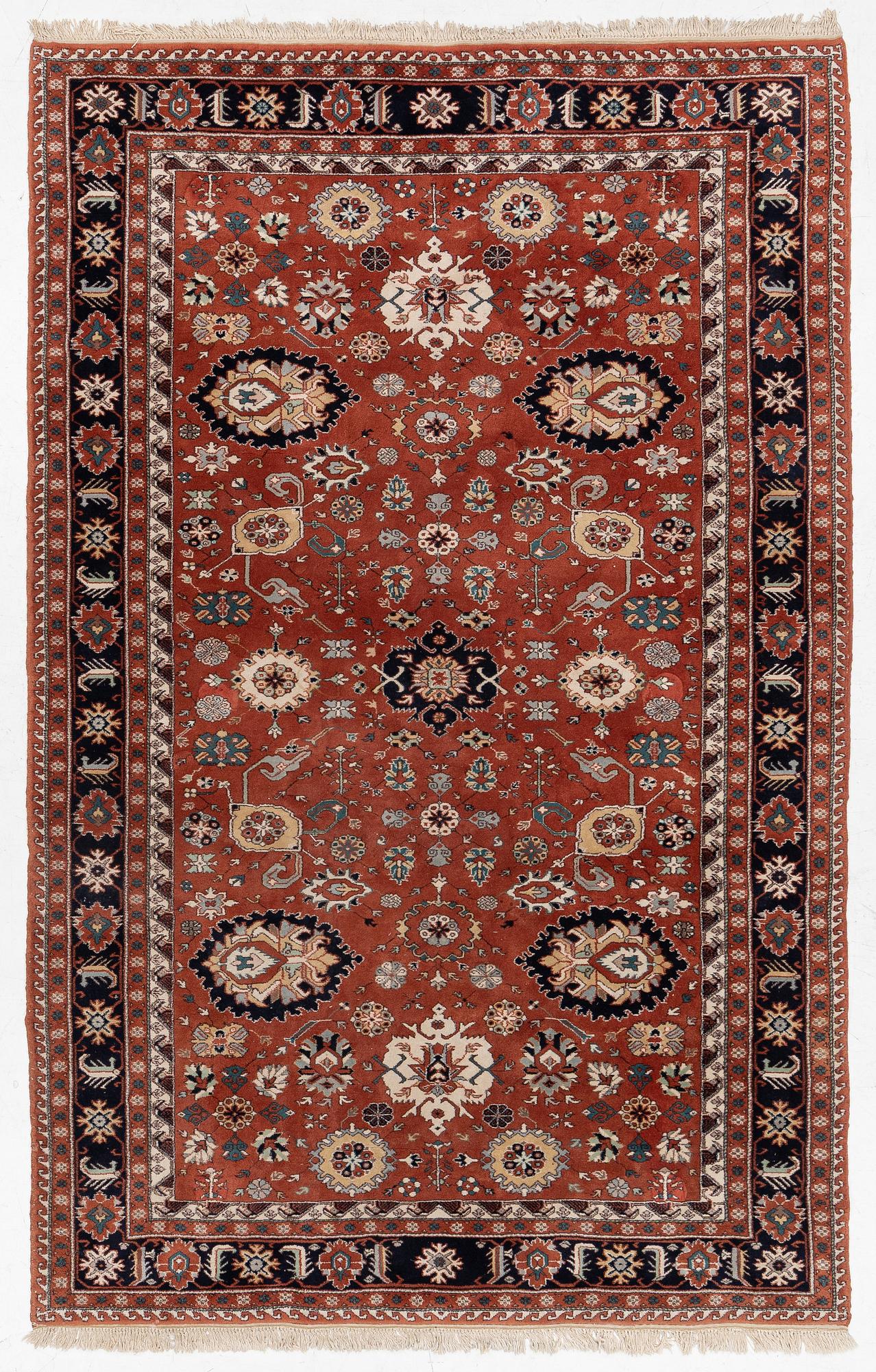 A semi-antique Orientall carpet c. 318 x 202 cm.