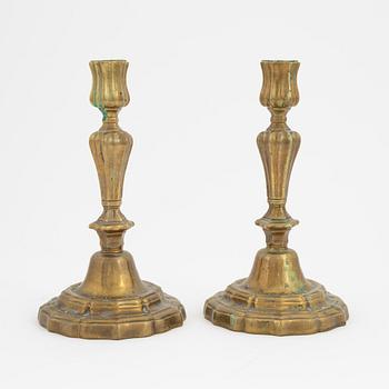 A pair of French brass candles sticks, 19th Century.