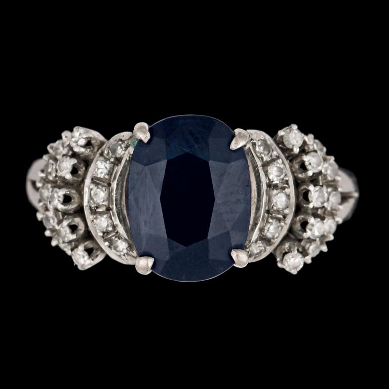 A blue sapphire and diamond ring.