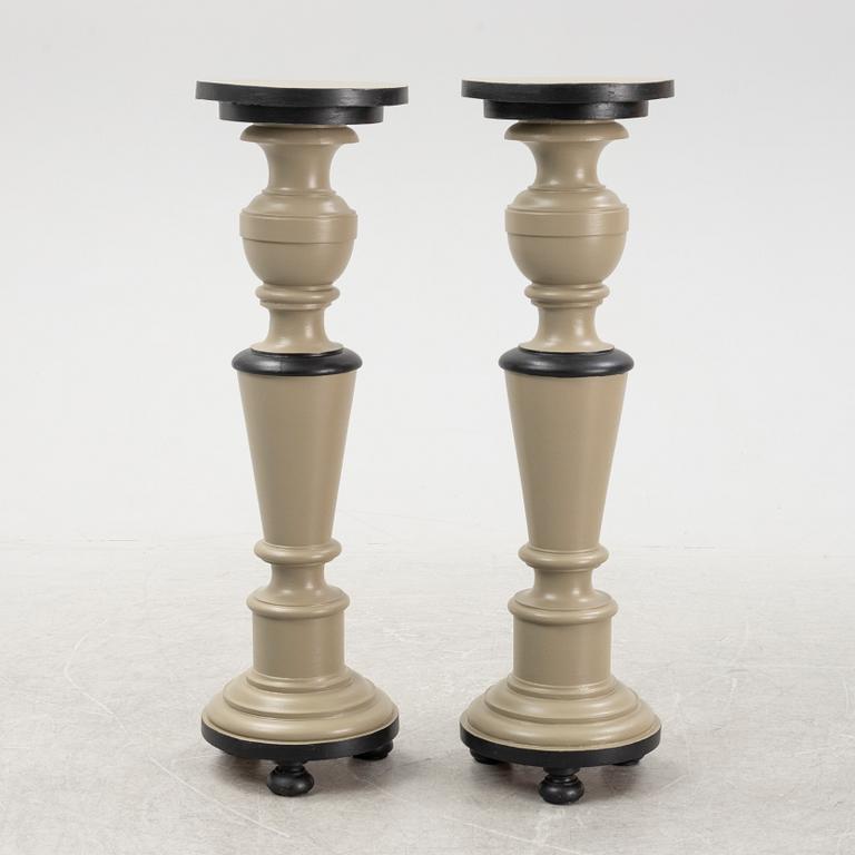 A pair of wooden piedestals, 20th Century.