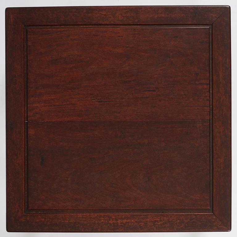 A Chinese hardwood corner-leg table, Qing dynasty.