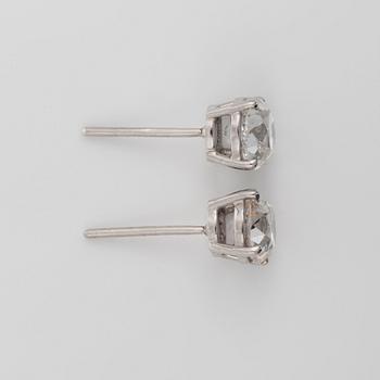 A pair of old-cut diamond solitaire earrings. Total carat weight circa 3.26 cts. Quality circa K-L/VS-SI.