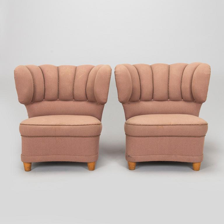 A pair of mid-20th century armchairs.