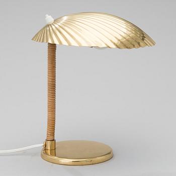 PAAVO TYNELL, A DESK LAMP. A shell.  Manufactured by Taito Oy. Designed in 1938/39.