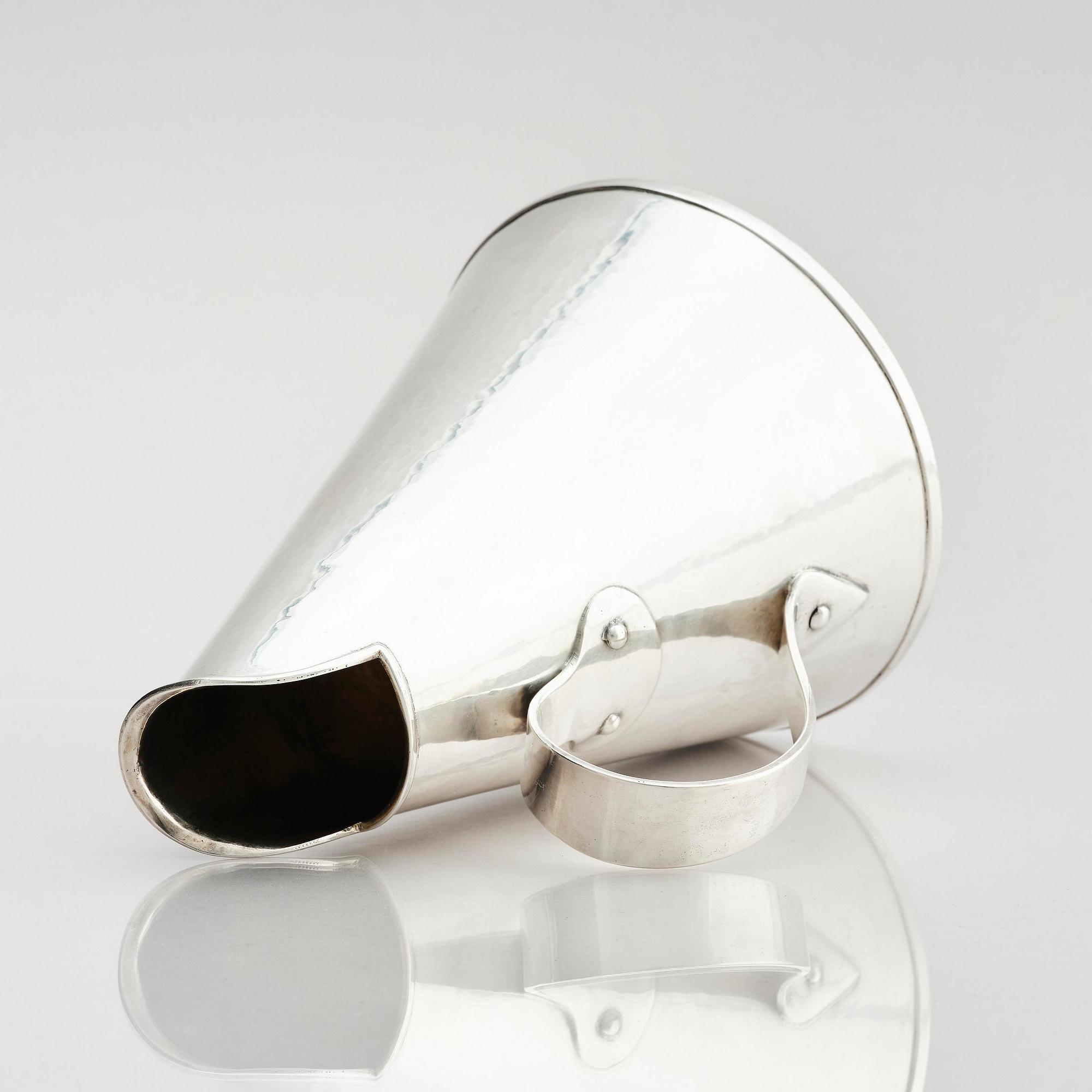 G H Markenius, a silver pitcher with handle, Stockholm 1957.