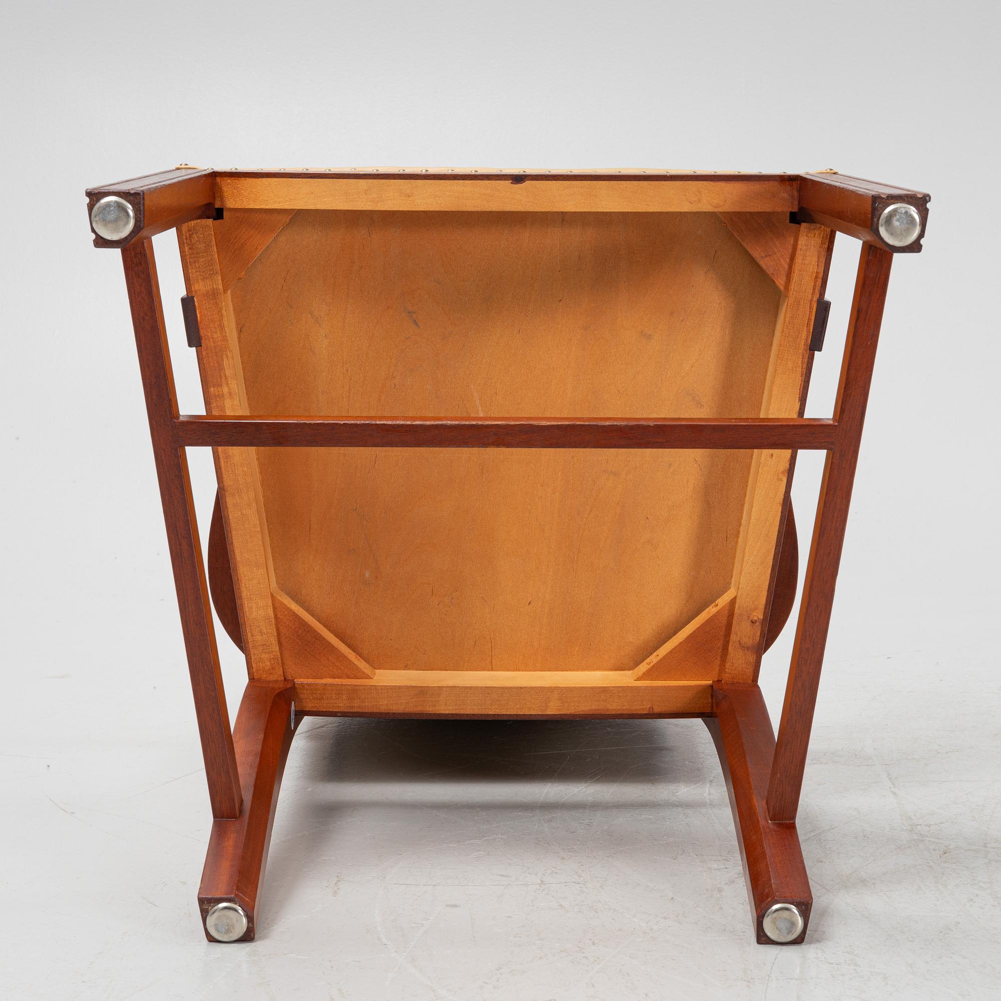 A par of stained beech wood armchairs, end of the 20th Century.