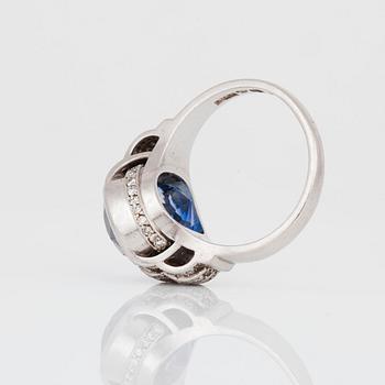 A circa 11.00 ct sapphire and single-cut diamond ring. Total carat weight of diamonds circa 0.40 ct.