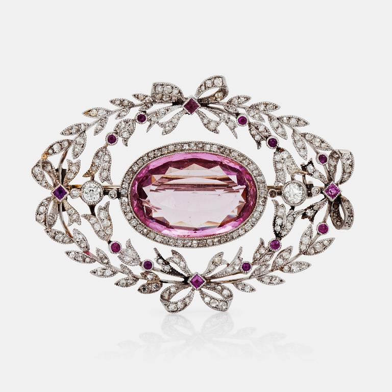 A circa 8.50 ct pink topaz and diamond brooch.