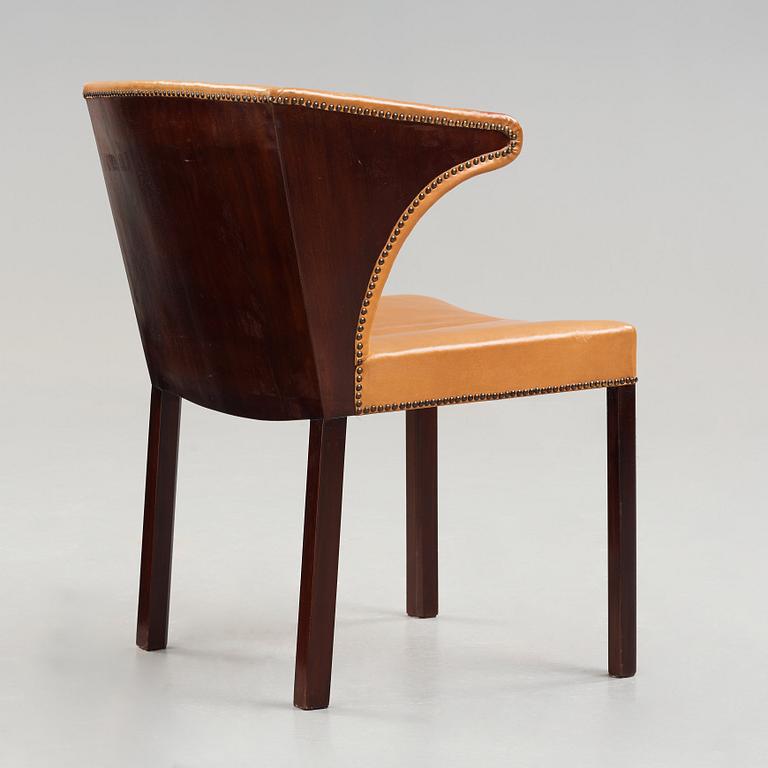 Frits Henningsen, a stained mahogany and brown leather armchair, Denmark.