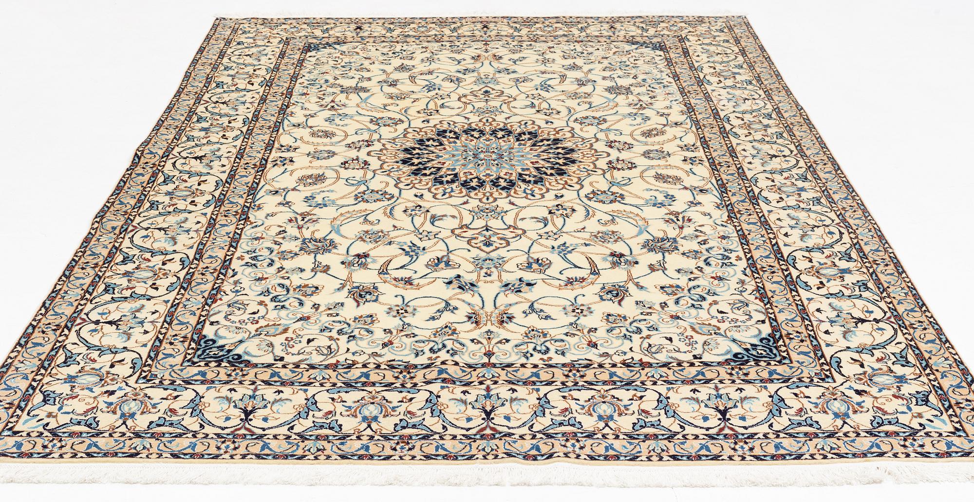 A carpet, Nain, part silk, fine 9 laa, signed, ca 327 x 210 cm.