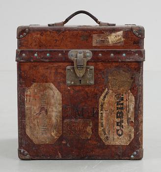 A early 20th cent brown leather trunk by Louis Vuitton.