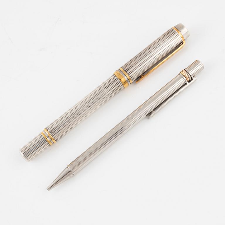 Two pens, Waterman and Cartier.
