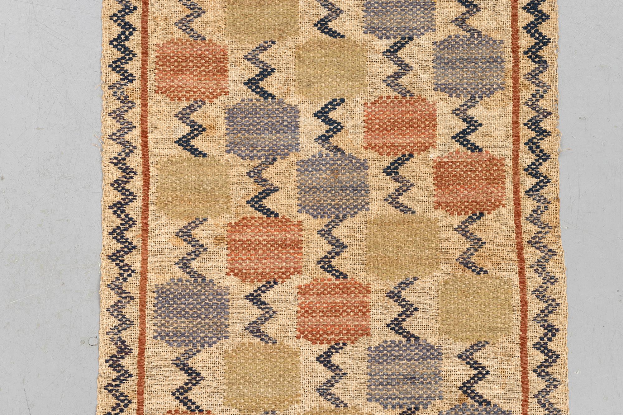 Märta Måås-Fjetterström, A textile, "Skaftblomman", flat weave, ca 131,5 x 47 cm, signed MMF.